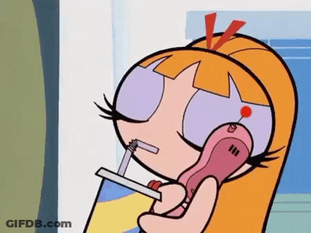 Blossom From The Powerpuff Girls Is Talking On A Cell Phone With A Straw . GIF