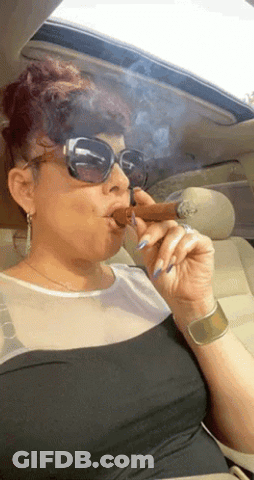 Blowing And Smoking Cigar Lady GIF
