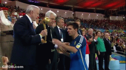 Blue Adidas Jersey Man Receiving Trophy From Suited Man GIF