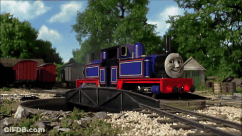 Blue And Red Smiling Train On Track GIF