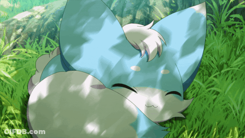 Blue And White Animal Lying In Grass GIF