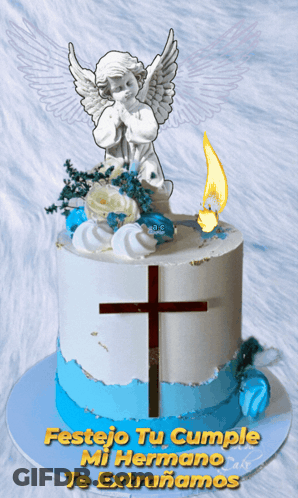 Blue And White Cake With Cross And Angel GIF