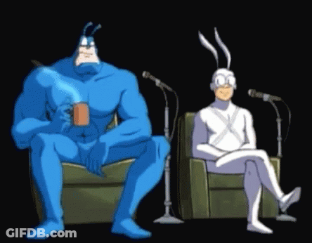 Blue And White Cartoon Characters Sitting At Microphones GIF