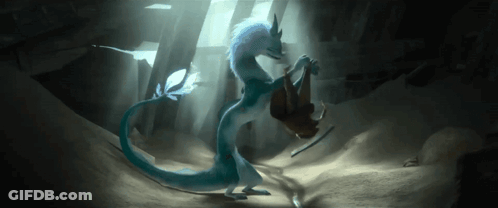 Blue And White Dragon Standing Next To Person In Cave GIF