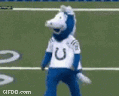 Blue And White Mascot Standing On Field GIF