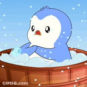 Blue And White Penguin Sitting In Wooden Tub GIF