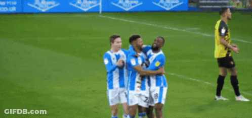 Blue And White Striped Soccer Players Celebrating Goal GIF