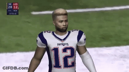Blue And Yellow Football Helmet With Rams Logo GIF