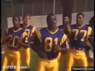 Blue And Yellow Football Players Standing In Line GIF