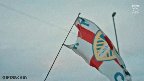 Blue And Yellow Leeds United Logo With Arms Crossed GIF