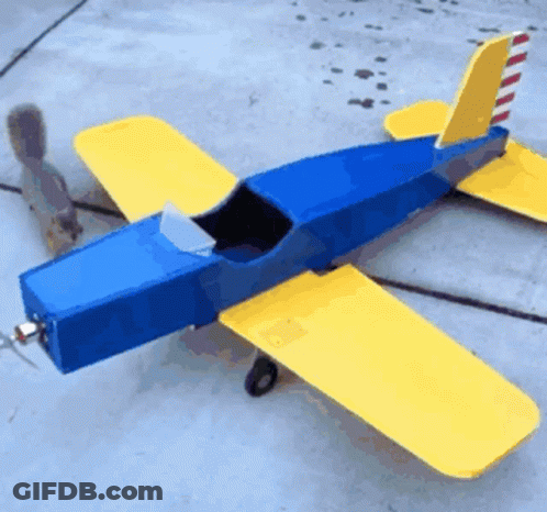 Blue And Yellow Model Airplane On Concrete GIF