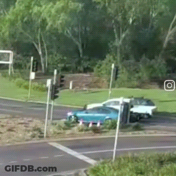 Blue Car And White Car Driving GIF
