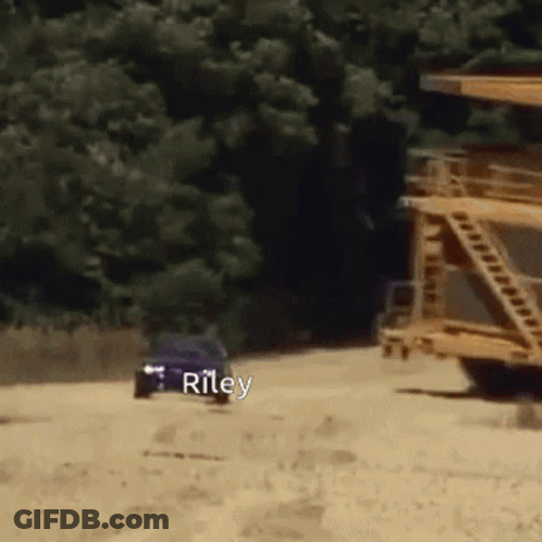 Blue Car Driving Down Dirt Road With Riley Written On It GIF
