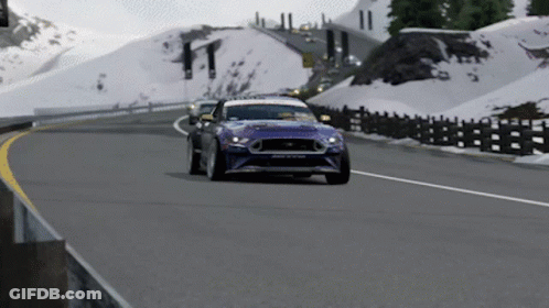 Blue Car Driving On Road With Sign O GIF