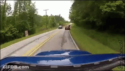 Blue Car Driving Past Do Not Enter Sign GIF