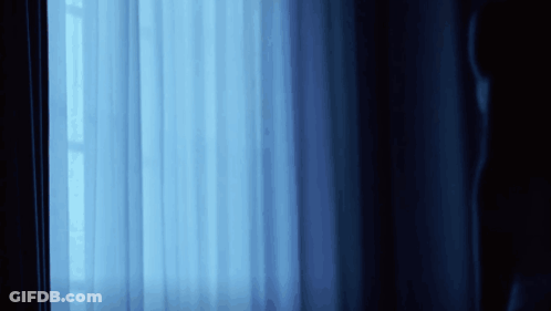 Blue Curtain With Light Through Window GIF
