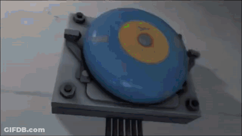 Blue Disc Yellow Center On Metal GIF