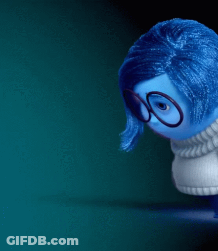 Blue Doll With Glasses Looking Down GIF