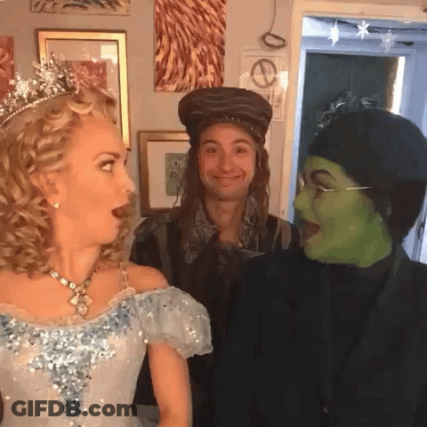 Blue Dress Woman Hat Man Green Mask Woman GIF
