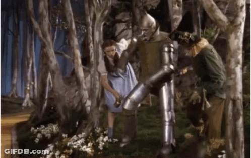 Blue Dress Woman With Armored Man And Scarecrow GIF