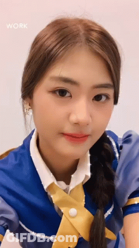 Blue Dress Yellow Tie Girl Looking At Camera GIF