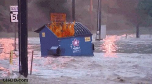 Blue Dumpster Floating In Flooded Area With 5 Sign GIF
