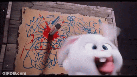 Blue-Eyed Stuffed Rabbits Looking At Camera GIF
