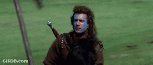 Blue-Faced Man Riding Horse With Sword GIF