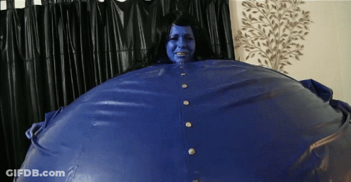 Blue-Faced Woman In Blue Jacket GIF