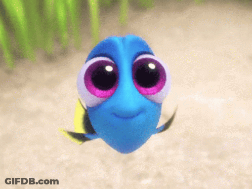 Blue Fish With Big Pink Eyes Swimming In Sand GIF