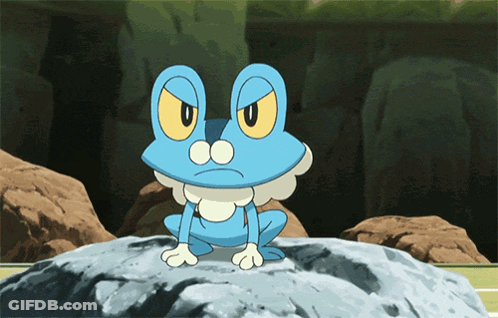 Blue Frog With Yellow Eyes Sitting On Rock GIF