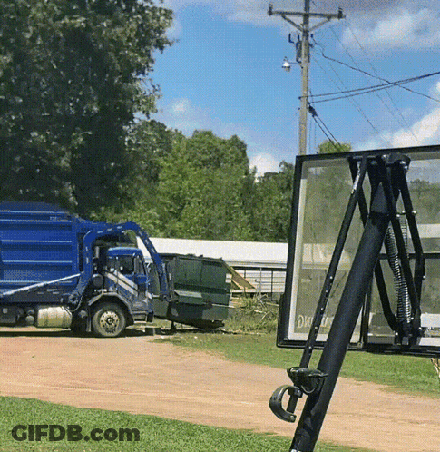 Blue Garbage Truck Next To Basketball Net GIF