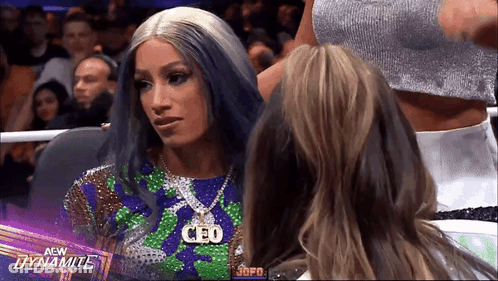 Blue Hair Woman With CEO Necklace In Wrestling Ring GIF
