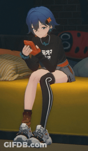 Blue-Haired Girl On Yellow Couch Holding Controller GIF