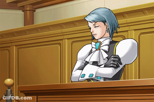 Blue-Haired Man At Podium Arms Crossed GIF