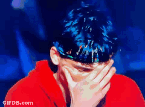 Blue-Haired Man Covering Face GIF