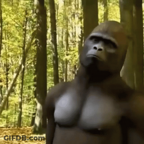 Blue-Haired Man Sitting Shirtless On Couch GIF