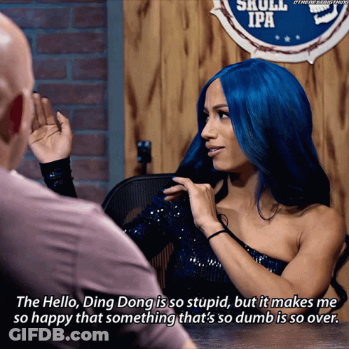 Blue-Haired Woman Talking To Man Near Skull IPA Sign GIF