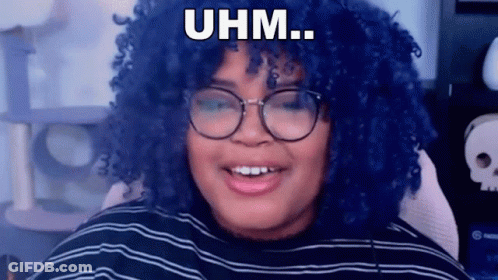 Blue-Haired Woman With Glasses Smiling In Striped Shirt GIF