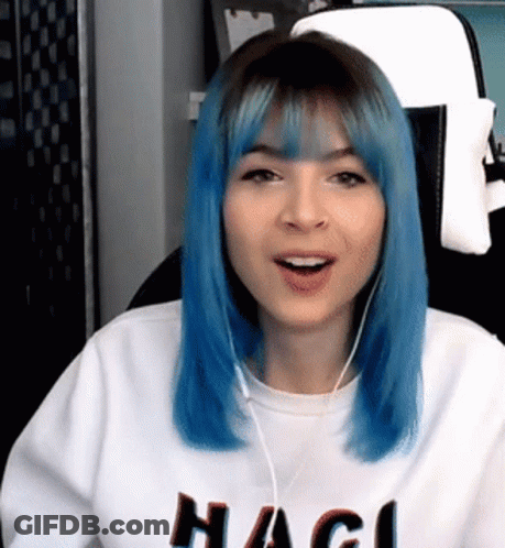 Blue-Haired Woman With Headphones And Hagi Sweater GIF