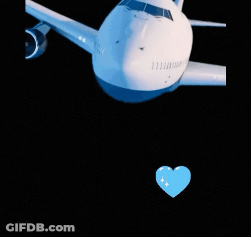 Blue Heart Floating Near White Object GIF