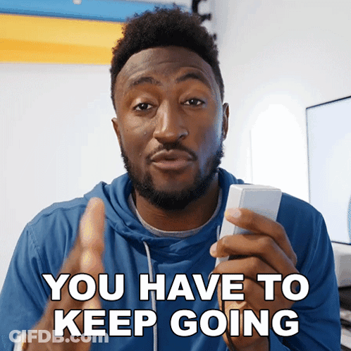 Blue Hoodie Man Holding Remote Control You Have To Keep Going GIF