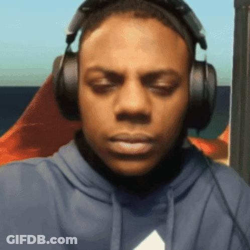 Blue Hoodie Man With Headphones Looking At Camera GIF