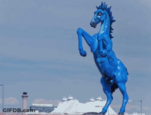 Blue Horse With Red Eye Next To Black Horse GIF