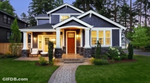 Blue House With Red Door And Brick Walkway GIF
