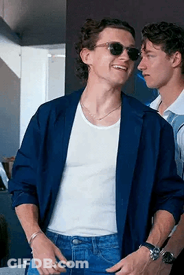 Blue Jacket Sunglasses Man Beside White Tank Top Man GIF