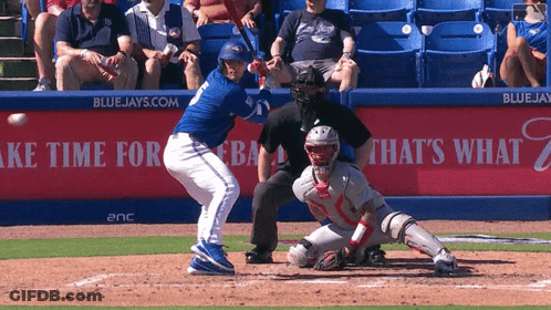 Blue Jays Baseball Player Swinging At Ball GIF