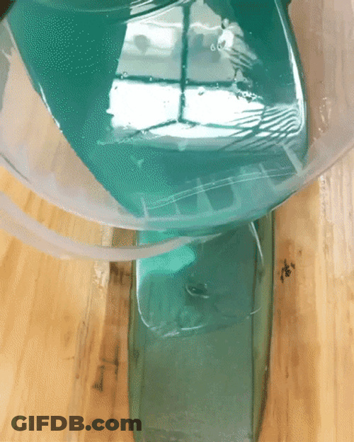 Blue Liquid Water Pouring On Wood GIF