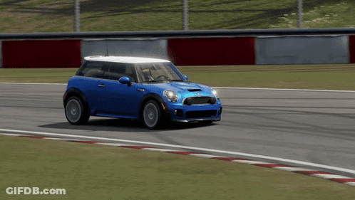 Blue Mini Cooper Driving Down Race Track GIF