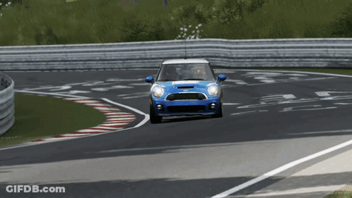 Blue Mini Cooper Driving Down Race Track GIF